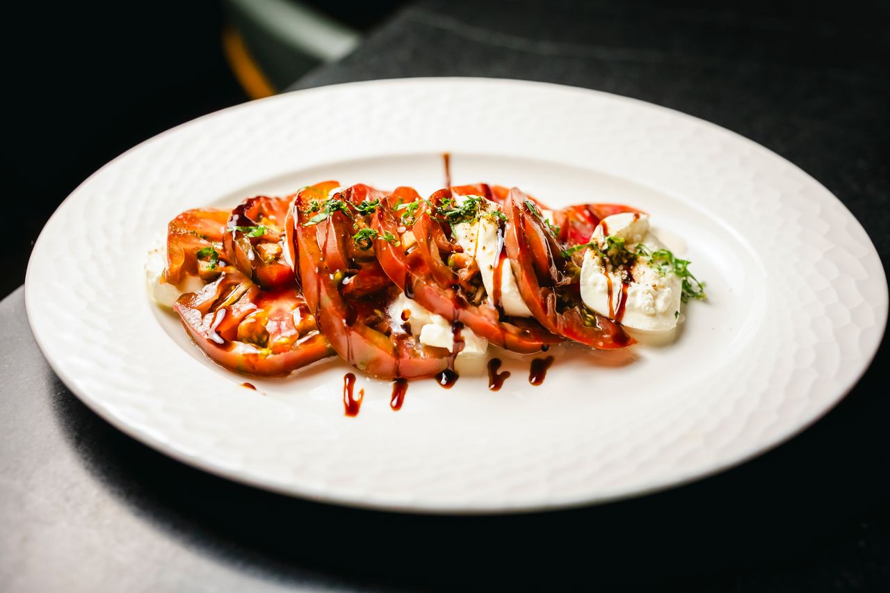 Heirloom tomato caprese with balsamic drizzle at The Boardroom